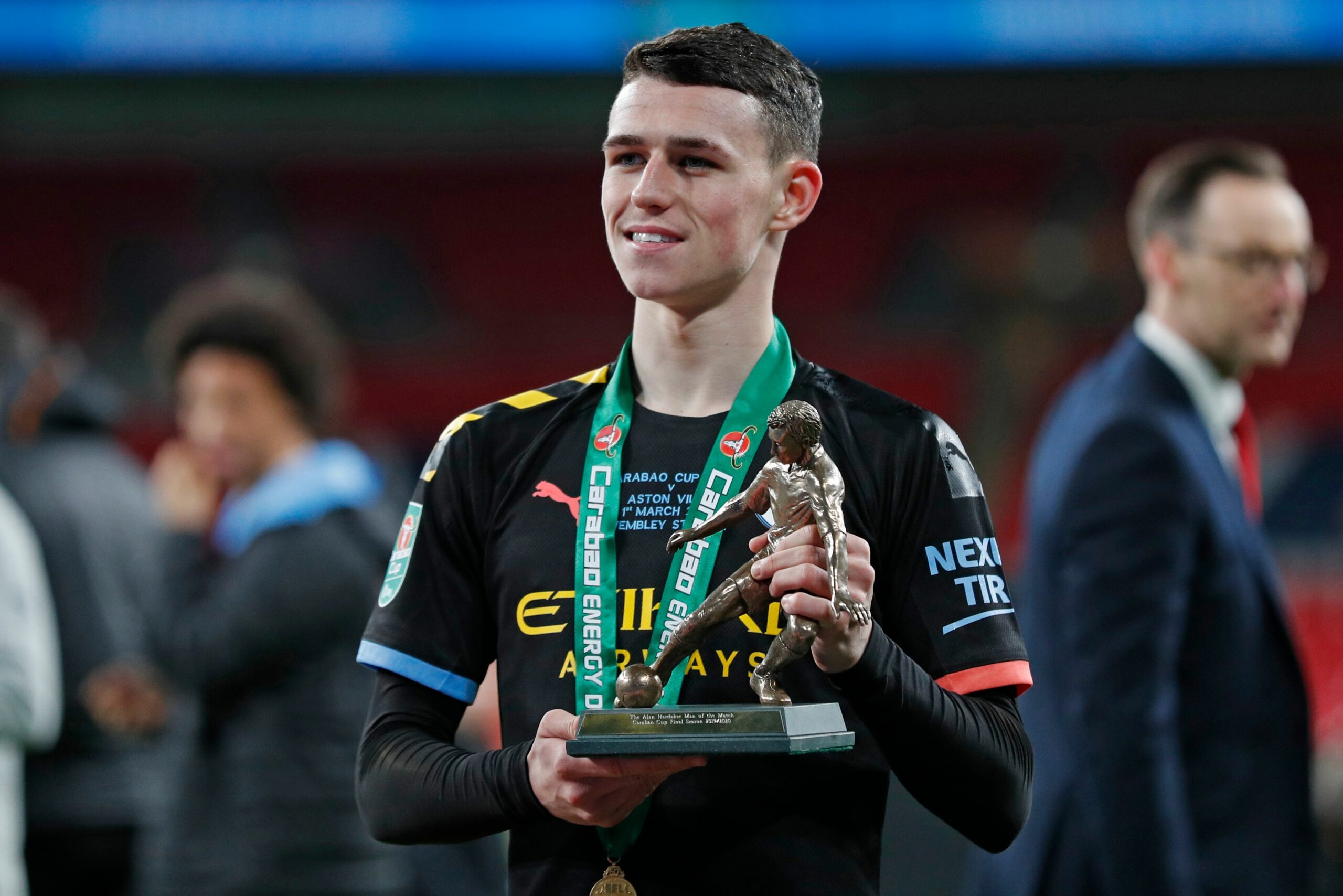 Manchester City's English midfielder Phil Foden poses for a photograph...